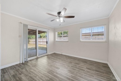 Discover an incredible opportunity to own a 4-bedroom brick home on Tiger Point Golf and Country Club in Florida - for sale on GolfHomes.com, golf home, golf lot
