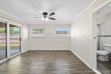 Discover an incredible opportunity to own a 4-bedroom brick home on Tiger Point Golf and Country Club in Florida - for sale on GolfHomes.com, golf home, golf lot