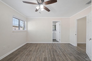 Discover an incredible opportunity to own a 4-bedroom brick home on Tiger Point Golf and Country Club in Florida - for sale on GolfHomes.com, golf home, golf lot