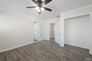 Discover an incredible opportunity to own a 4-bedroom brick home on Tiger Point Golf and Country Club in Florida - for sale on GolfHomes.com, golf home, golf lot