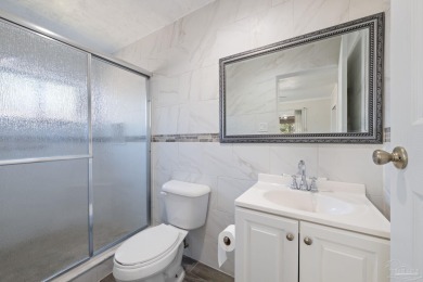 Discover an incredible opportunity to own a 4-bedroom brick home on Tiger Point Golf and Country Club in Florida - for sale on GolfHomes.com, golf home, golf lot