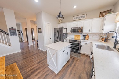 Welcome to this beautifully updated 6-bedroom, 2.5-bath home on Eagle Creek Golf Club and Grill in North Carolina - for sale on GolfHomes.com, golf home, golf lot