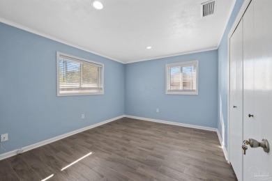Discover an incredible opportunity to own a 4-bedroom brick home on Tiger Point Golf and Country Club in Florida - for sale on GolfHomes.com, golf home, golf lot