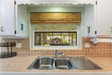 Don't Miss This Canal-Front Charmer!  Located in the desirable on Indian Lake Estates Golf and Country Club in Florida - for sale on GolfHomes.com, golf home, golf lot
