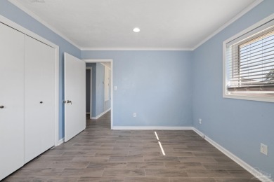 Discover an incredible opportunity to own a 4-bedroom brick home on Tiger Point Golf and Country Club in Florida - for sale on GolfHomes.com, golf home, golf lot