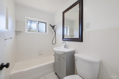 Discover an incredible opportunity to own a 4-bedroom brick home on Tiger Point Golf and Country Club in Florida - for sale on GolfHomes.com, golf home, golf lot
