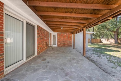 Discover an incredible opportunity to own a 4-bedroom brick home on Tiger Point Golf and Country Club in Florida - for sale on GolfHomes.com, golf home, golf lot