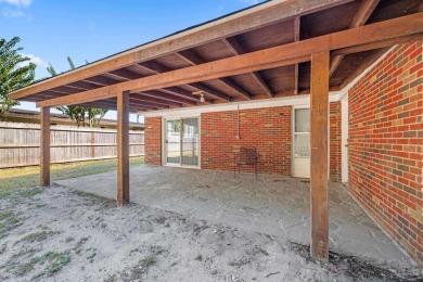 Discover an incredible opportunity to own a 4-bedroom brick home on Tiger Point Golf and Country Club in Florida - for sale on GolfHomes.com, golf home, golf lot