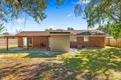 Discover an incredible opportunity to own a 4-bedroom brick home on Tiger Point Golf and Country Club in Florida - for sale on GolfHomes.com, golf home, golf lot