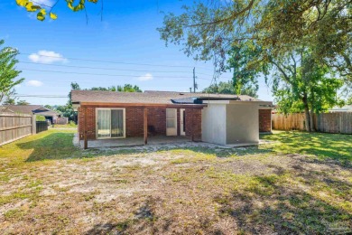 Discover an incredible opportunity to own a 4-bedroom brick home on Tiger Point Golf and Country Club in Florida - for sale on GolfHomes.com, golf home, golf lot