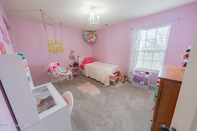 Welcome to this beautifully updated 6-bedroom, 2.5-bath home on Eagle Creek Golf Club and Grill in North Carolina - for sale on GolfHomes.com, golf home, golf lot