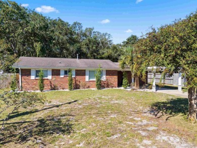 Discover an incredible opportunity to own a 4-bedroom brick home on Tiger Point Golf and Country Club in Florida - for sale on GolfHomes.com, golf home, golf lot