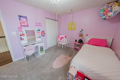 Welcome to this beautifully updated 6-bedroom, 2.5-bath home on Eagle Creek Golf Club and Grill in North Carolina - for sale on GolfHomes.com, golf home, golf lot