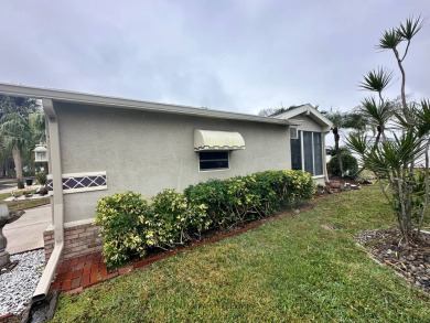 Beautiful stucco home on the exterior perimeter.  Updated on Del Tura Golf and Country Club in Florida - for sale on GolfHomes.com, golf home, golf lot