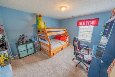 Welcome to this beautifully updated 6-bedroom, 2.5-bath home on Eagle Creek Golf Club and Grill in North Carolina - for sale on GolfHomes.com, golf home, golf lot