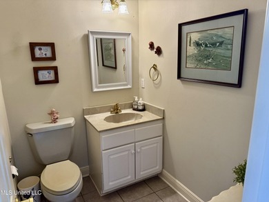 After 30 years of single family ownership, this 2,486 SF home is on Pass Christian Isles Golf Club in Mississippi - for sale on GolfHomes.com, golf home, golf lot