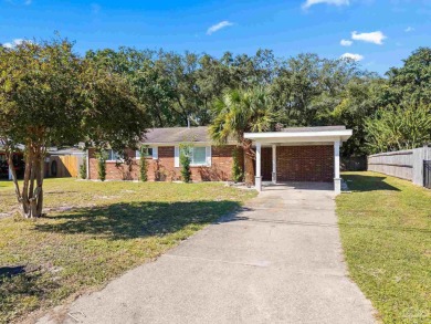 Discover an incredible opportunity to own a 4-bedroom brick home on Tiger Point Golf and Country Club in Florida - for sale on GolfHomes.com, golf home, golf lot