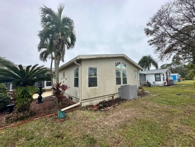 Beautiful stucco home on the exterior perimeter.  Updated on Del Tura Golf and Country Club in Florida - for sale on GolfHomes.com, golf home, golf lot
