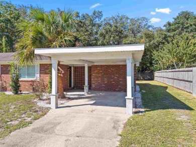 Discover an incredible opportunity to own a 4-bedroom brick home on Tiger Point Golf and Country Club in Florida - for sale on GolfHomes.com, golf home, golf lot