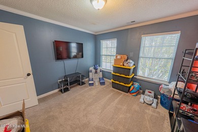 Welcome to this beautifully updated 6-bedroom, 2.5-bath home on Eagle Creek Golf Club and Grill in North Carolina - for sale on GolfHomes.com, golf home, golf lot