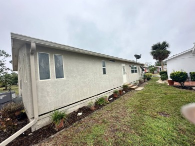 Beautiful stucco home on the exterior perimeter.  Updated on Del Tura Golf and Country Club in Florida - for sale on GolfHomes.com, golf home, golf lot
