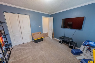 Welcome to this beautifully updated 6-bedroom, 2.5-bath home on Eagle Creek Golf Club and Grill in North Carolina - for sale on GolfHomes.com, golf home, golf lot