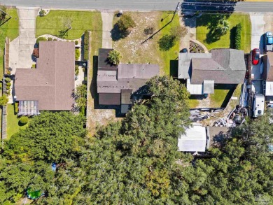 Discover an incredible opportunity to own a 4-bedroom brick home on Tiger Point Golf and Country Club in Florida - for sale on GolfHomes.com, golf home, golf lot