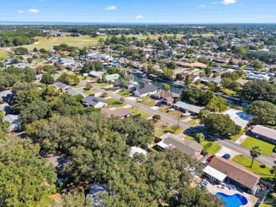 Discover an incredible opportunity to own a 4-bedroom brick home on Tiger Point Golf and Country Club in Florida - for sale on GolfHomes.com, golf home, golf lot