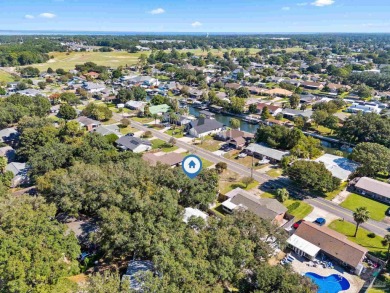 Discover an incredible opportunity to own a 4-bedroom brick home on Tiger Point Golf and Country Club in Florida - for sale on GolfHomes.com, golf home, golf lot