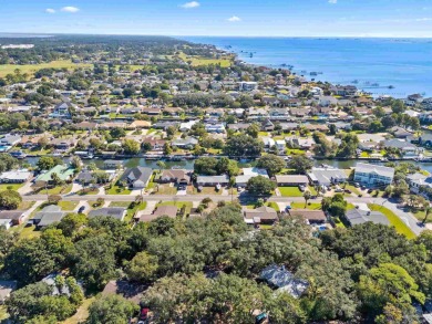 Discover an incredible opportunity to own a 4-bedroom brick home on Tiger Point Golf and Country Club in Florida - for sale on GolfHomes.com, golf home, golf lot