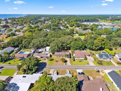 Discover an incredible opportunity to own a 4-bedroom brick home on Tiger Point Golf and Country Club in Florida - for sale on GolfHomes.com, golf home, golf lot