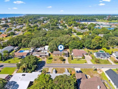 Discover an incredible opportunity to own a 4-bedroom brick home on Tiger Point Golf and Country Club in Florida - for sale on GolfHomes.com, golf home, golf lot