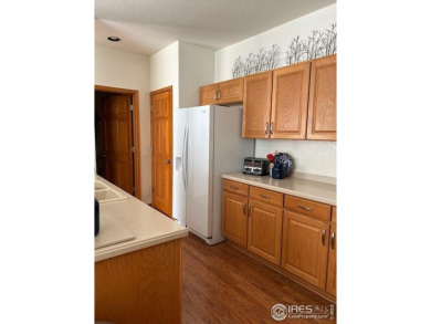 Check out this spacious & sunny end unit w/golf course views! It on The Broadlands Golf Course in Colorado - for sale on GolfHomes.com, golf home, golf lot