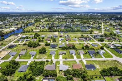 Located in NE Cape, this 3 bedroom, 2 bathroom home offers a on Del Tura Golf and Country Club in Florida - for sale on GolfHomes.com, golf home, golf lot