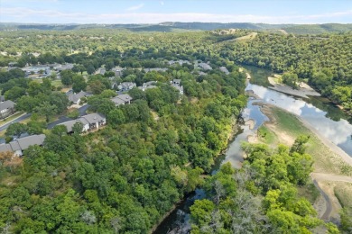 Discover lakeside luxury at its finest! This completely on Pointe Royale Village Country Club in Missouri - for sale on GolfHomes.com, golf home, golf lot