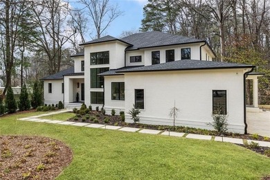 Stunning new construction tucked at the end of a cul-de-sac in on North Fulton Golf Course in Georgia - for sale on GolfHomes.com, golf home, golf lot