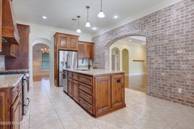 Showstopping two-story home on the pond in Squirrel Run! This on Squirrel Run Golf Courses in Louisiana - for sale on GolfHomes.com, golf home, golf lot