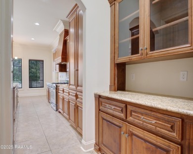 Showstopping two-story home on the pond in Squirrel Run! This on Squirrel Run Golf Courses in Louisiana - for sale on GolfHomes.com, golf home, golf lot
