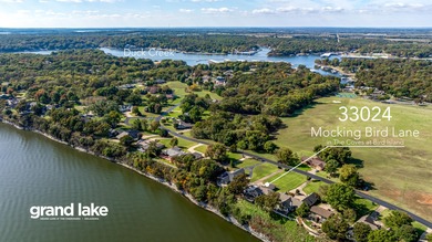 33024 Mockingbird Lane is a striking lakefront retreat that on The Coves Golf Course in Oklahoma - for sale on GolfHomes.com, golf home, golf lot