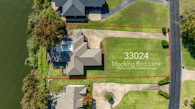 33024 Mockingbird Lane is a striking lakefront retreat that on The Coves Golf Course in Oklahoma - for sale on GolfHomes.com, golf home, golf lot