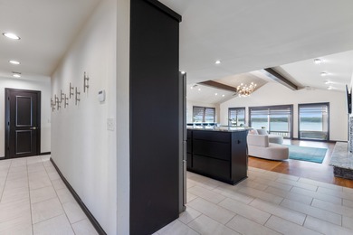 33024 Mockingbird Lane is a striking lakefront retreat that on The Coves Golf Course in Oklahoma - for sale on GolfHomes.com, golf home, golf lot