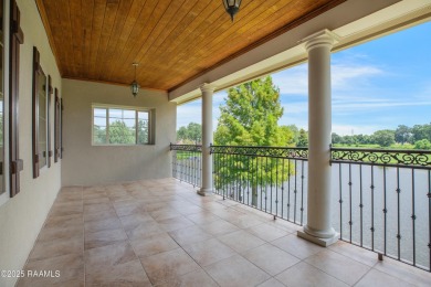 Showstopping two-story home on the pond in Squirrel Run! This on Squirrel Run Golf Courses in Louisiana - for sale on GolfHomes.com, golf home, golf lot