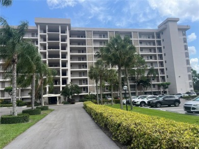Experience luxury in this coveted first-floor corner residence on Palm-Aire Country Club and Resort - Palms in Florida - for sale on GolfHomes.com, golf home, golf lot