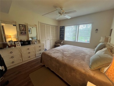 Experience luxury in this coveted first-floor corner residence on Palm-Aire Country Club and Resort - Palms in Florida - for sale on GolfHomes.com, golf home, golf lot