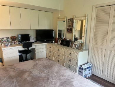 Experience luxury in this coveted first-floor corner residence on Palm-Aire Country Club and Resort - Palms in Florida - for sale on GolfHomes.com, golf home, golf lot
