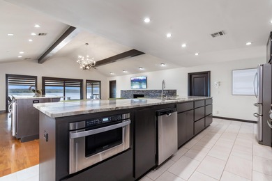 33024 Mockingbird Lane is a striking lakefront retreat that on The Coves Golf Course in Oklahoma - for sale on GolfHomes.com, golf home, golf lot