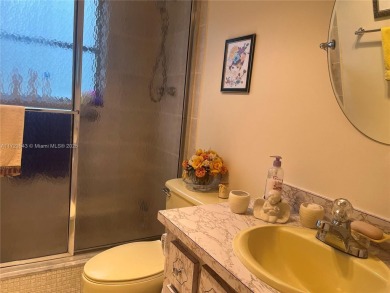 Experience luxury in this coveted first-floor corner residence on Palm-Aire Country Club and Resort - Palms in Florida - for sale on GolfHomes.com, golf home, golf lot
