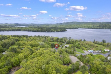 Located at the end of Belgrade Lakes Village, 14 Lakeshore Drive on Belgrade Lakes Golf Club in Maine - for sale on GolfHomes.com, golf home, golf lot