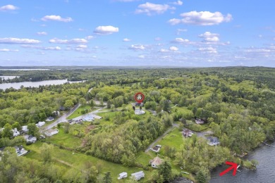 Located at the end of Belgrade Lakes Village, 14 Lakeshore Drive on Belgrade Lakes Golf Club in Maine - for sale on GolfHomes.com, golf home, golf lot