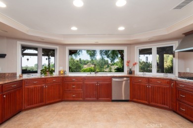 Step inside to find two expansive living areas, a large kitchen on Friendly Hills Country Club in California - for sale on GolfHomes.com, golf home, golf lot